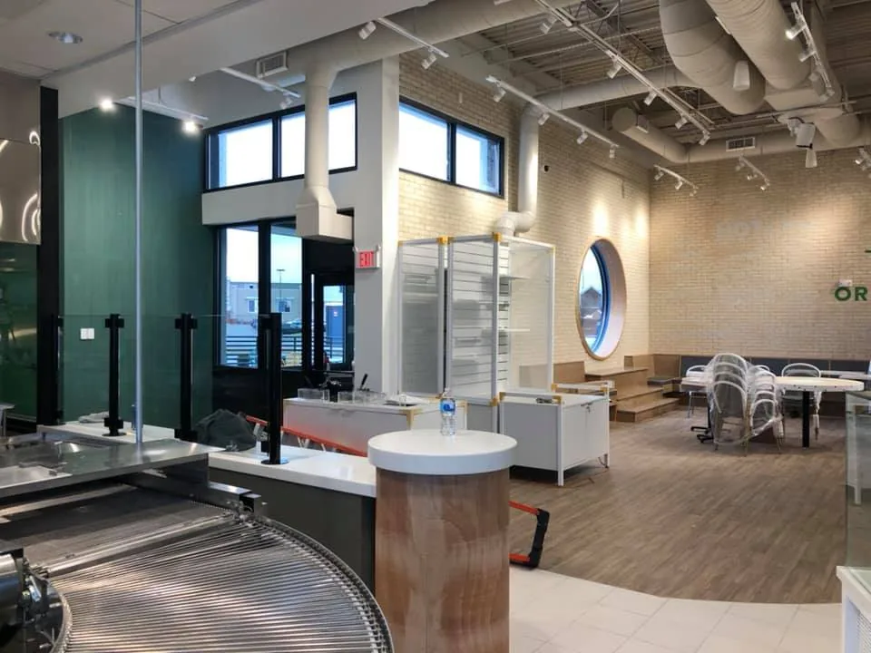 Modern commercial interior with freshly painted teal feature walls
