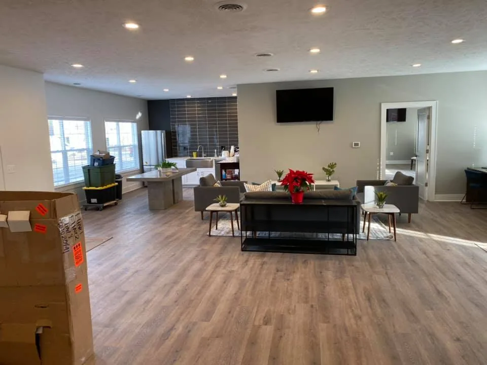 Open-concept living and dining space with freshly painted walls and ceilings and natural light
