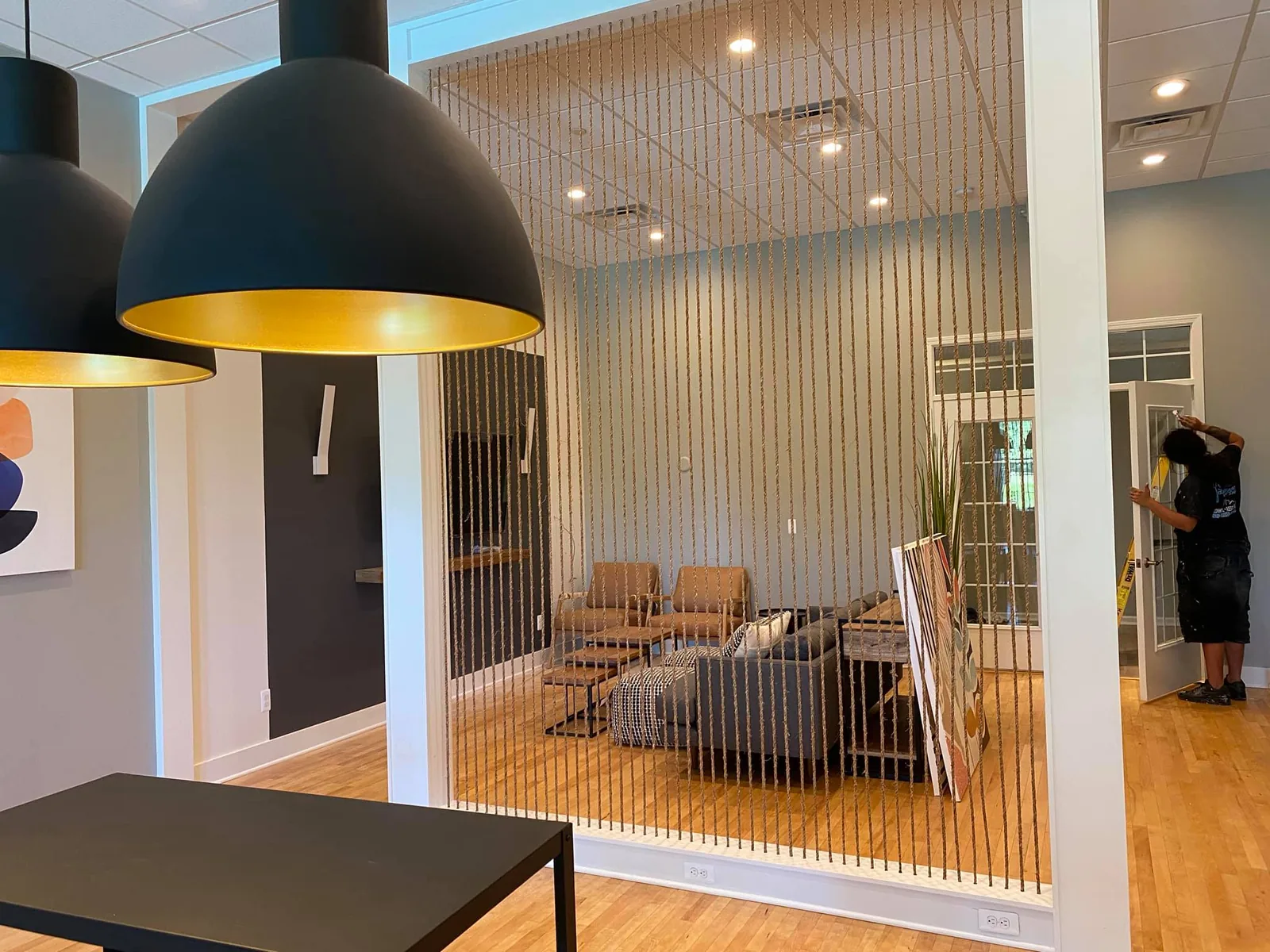 Modern interior with a painted wood slat accent wall and recessed lighting